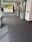 Matting by Design custom grey entrance mat installed in a bank lobby with ATM machines.