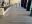 Matting by Design custom Bloomberg logo floor mat at a building entrance reception desk.